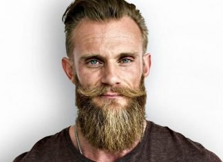 blonde bearded man looking straight into the camera
