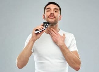 man using a trimmer for stubble