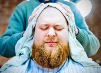 man with split-end beard at barbershop