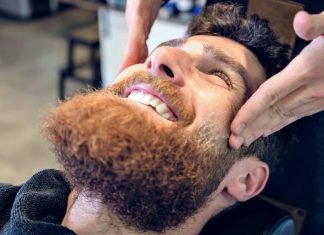 man getting his beard exfoliated